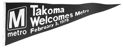 Black pennant featuring the Metro logo and the text "Takoma Welcomes Metro February 3, 1978," celebrating the Metro system's 50th anniversary.