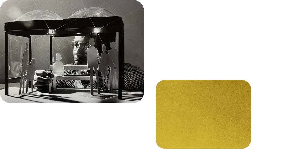 A person adjusts a miniature model of a Metro station, showcasing figures and lighting elements, symbolizing the design and planning of the Washington DC Metro system for its 50th anniversary. The model is set under a glass dome, highlighting the architectural features and creativity involved in the project.