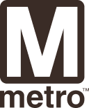 The emblem features a bold, stylized letter "M" in a dark color, representing the Metro system, with the word "metro" below it, celebrating the 50th anniversary of the Washington DC Metro.